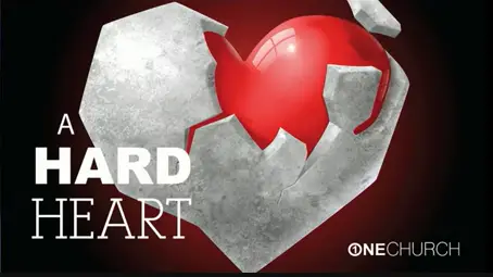 Cracked stone heart revealing red heart inside.